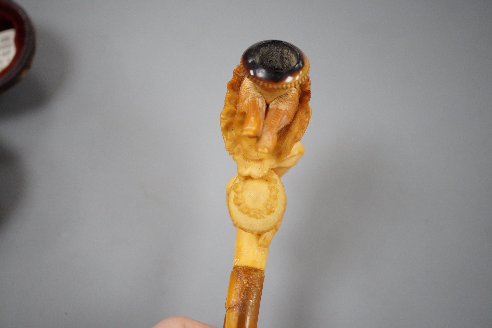 A Victorian erotic meerschaum pipe, 10.5 cm long, cased